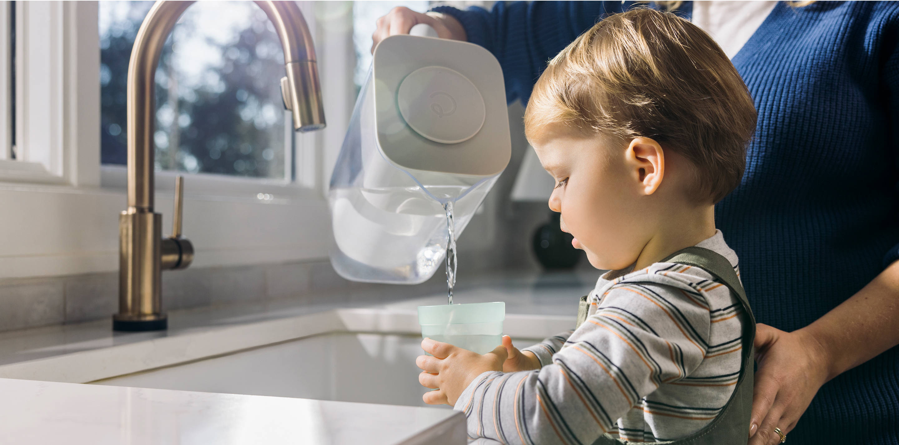 child drinking water poured from 10 cup zerowater pitcher