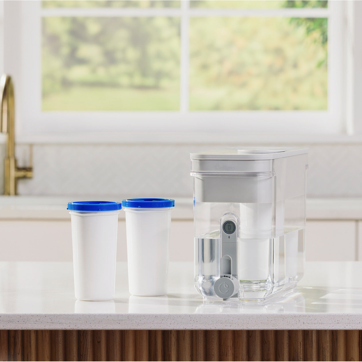 two zerowater filters next to 32 cup dispenser on kitchen counter