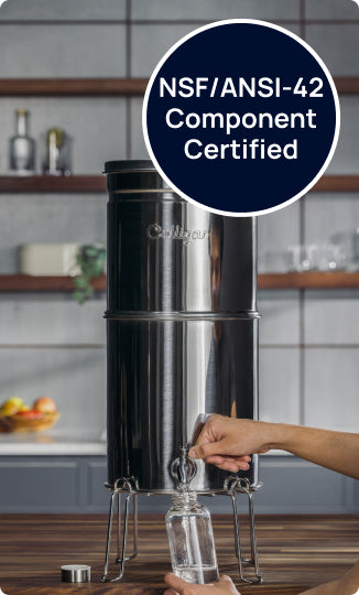 maxclear certified venture water system on counter with glass bottle