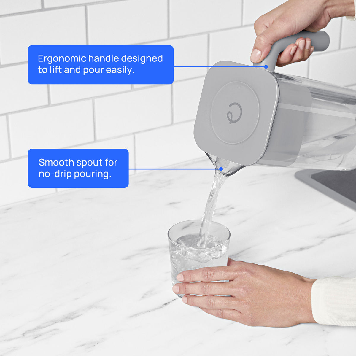 person using 7 cup zerowater pitcher to pour filtered water into glass