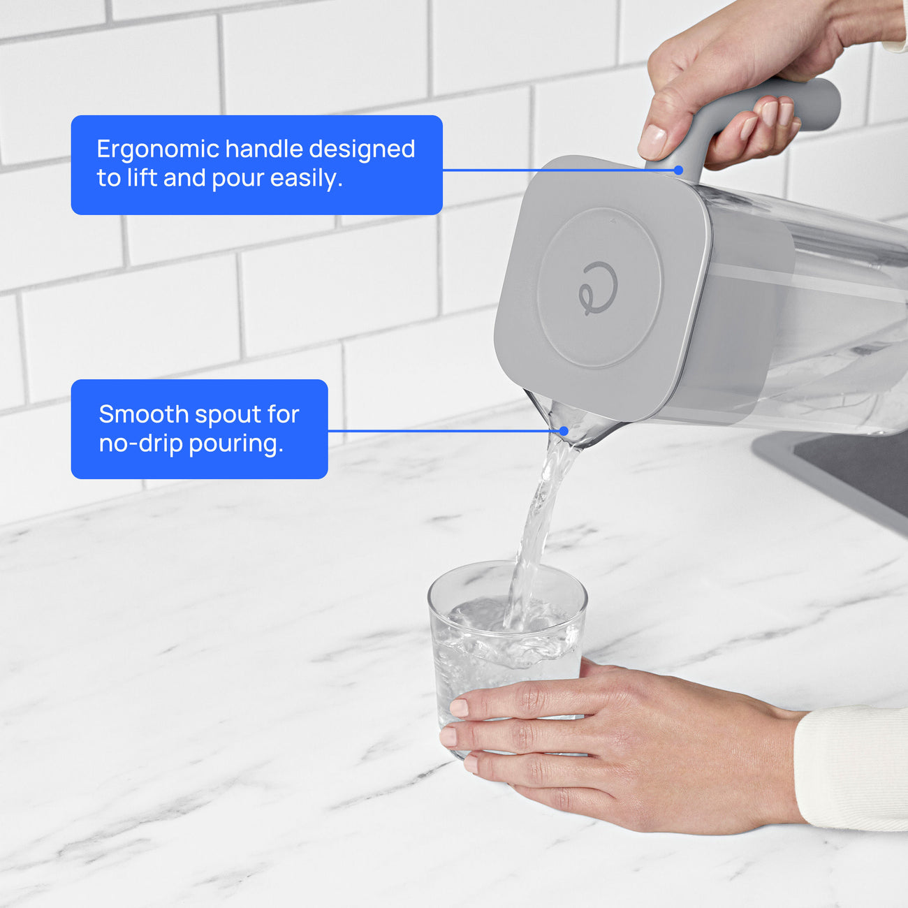 person using 7 cup zerowater pitcher to pour filtered water into glass