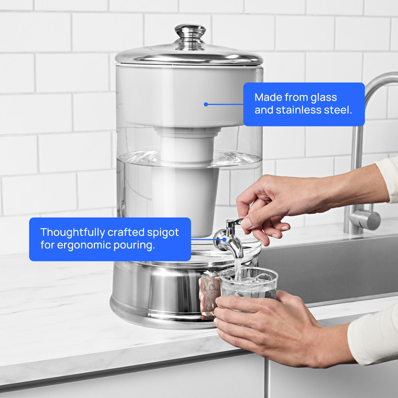 person using water spigot on 40 cup glass zerowater dispenser