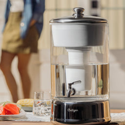 40 cup zerowater dispenser on picnic table next to food and drink